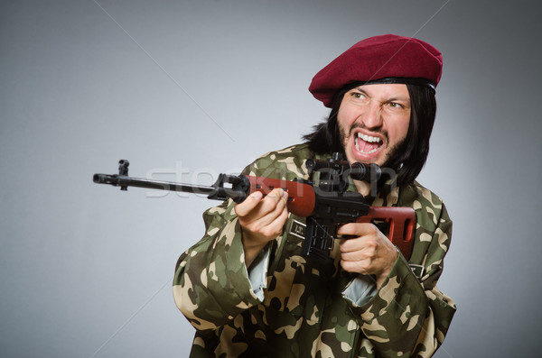 Soldier with handgun against gray Stock photo © Elnur