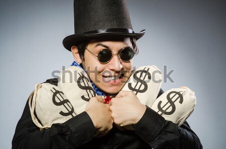 Stock photo: Woman gangster with gun and money