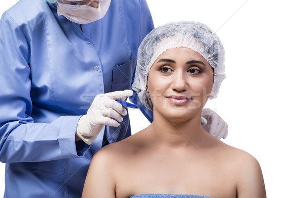 Young woman preparing for plastic surgery isolated on white Stock photo © Elnur