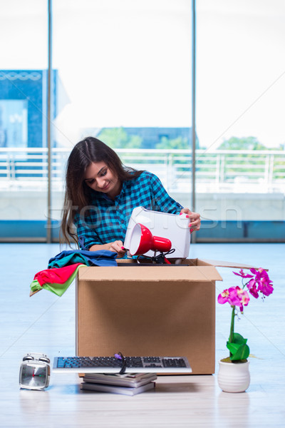 Young woman moving personal belongings Stock photo © Elnur