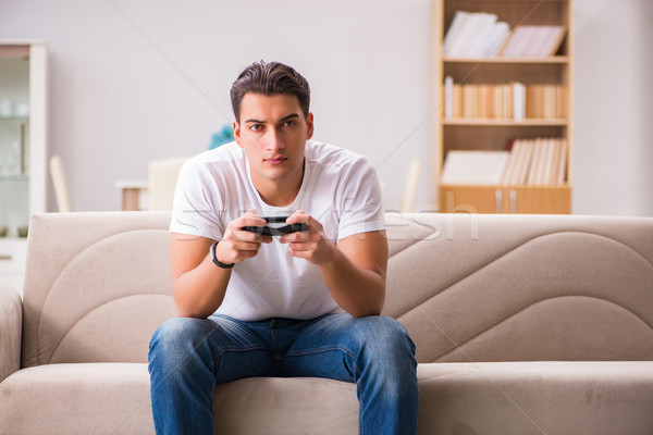 Stock photo: Man addicted to computer games