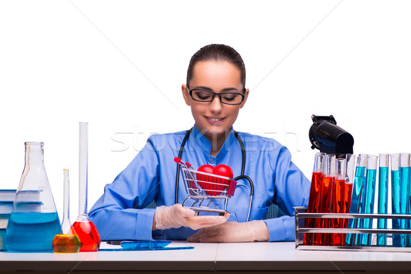 Young female doctor in lab isolated on white Stock photo © Elnur