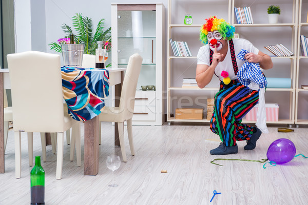 Stock photo: Drunk clown celebrating having a party at home