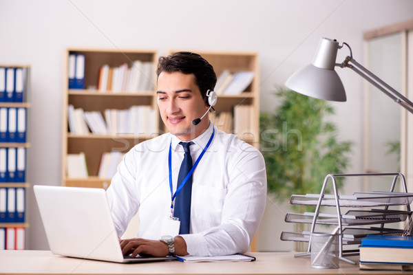 Handsome customer service clerk with headset  Stock photo © Elnur