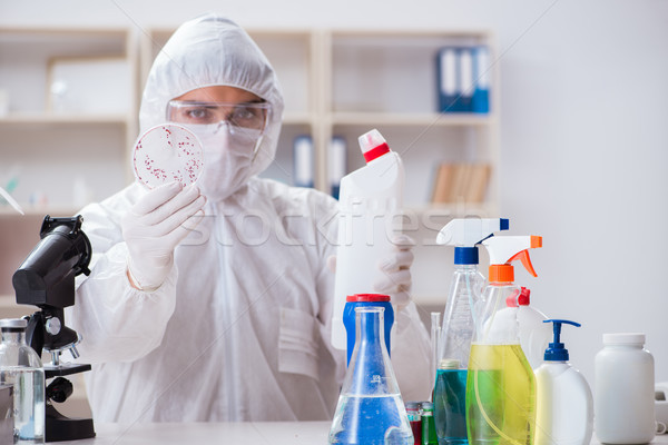 Chemist checking the quality of bathroom supplies Stock photo © Elnur