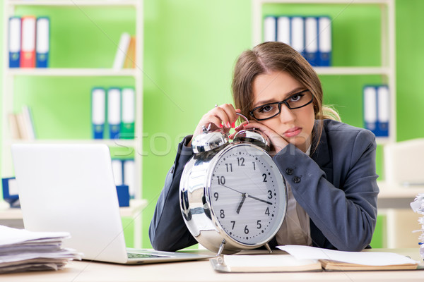Young female employee very busy with ongoing paperwork in time m Stock photo © Elnur