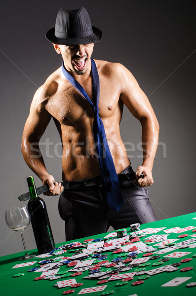 Naked broke businessman in casino Stock photo © Elnur