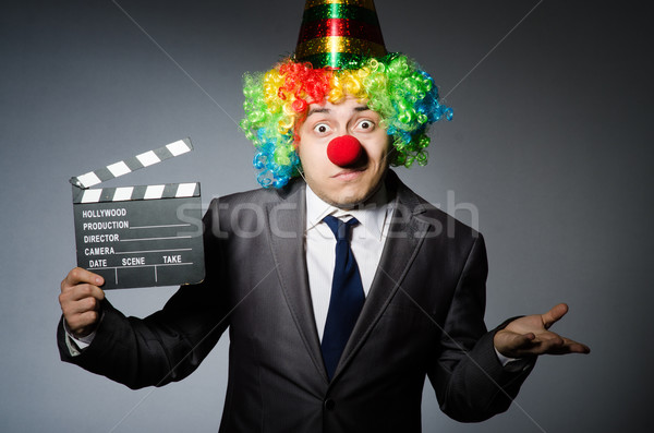 Clown with the movie board Stock photo © Elnur