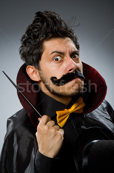 Funny magician man with wand and hat Stock photo © Elnur