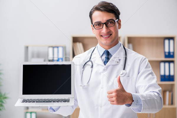 Young adult doctor with laptop computer Stock photo © Elnur