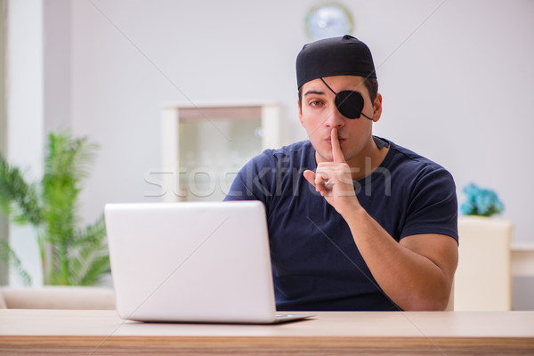 Digital security concept with pirate at computer Stock photo © Elnur