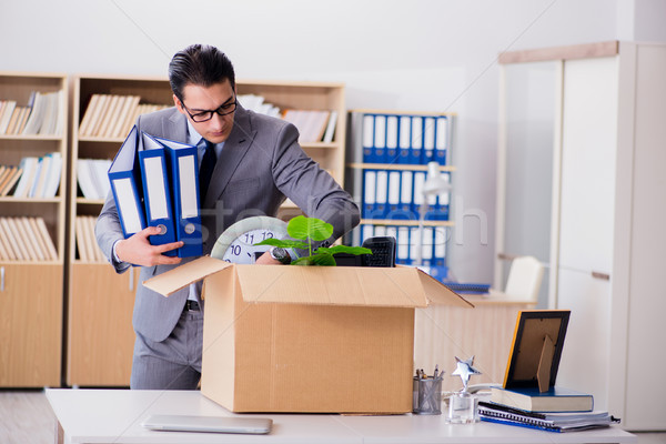 The man moving office with box and his belongings Stock photo © Elnur