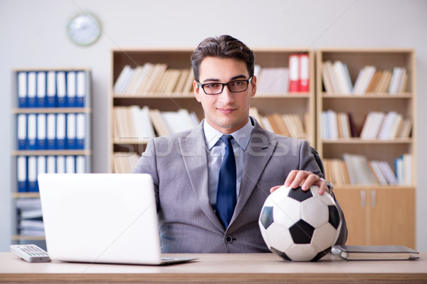 Businessman with football ball in office Stock photo © Elnur