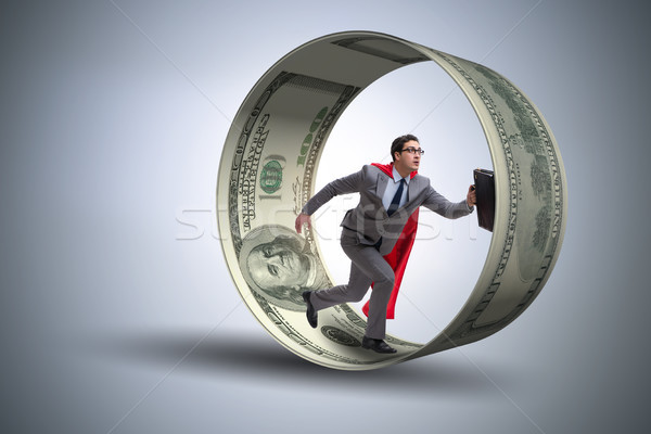Businessman in hamster wheel chasing dollars Stock photo © Elnur