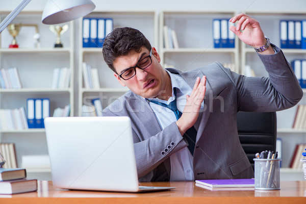 Businessman sweating excessively smelling bad in office at workp Stock photo © Elnur