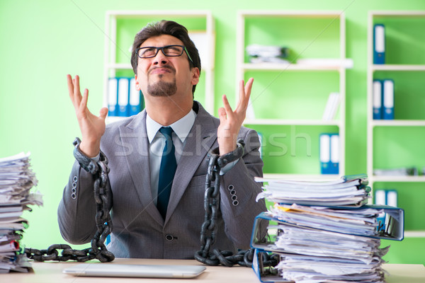 Employee chained to his desk due to workload Stock photo © Elnur