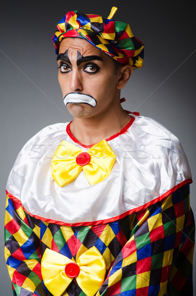 Sad clown against dark background Stock photo © Elnur