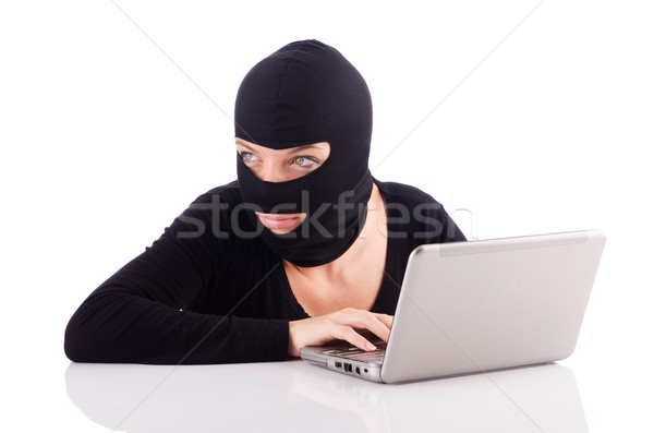 Hacker with computer wearing balaclava Stock photo © Elnur