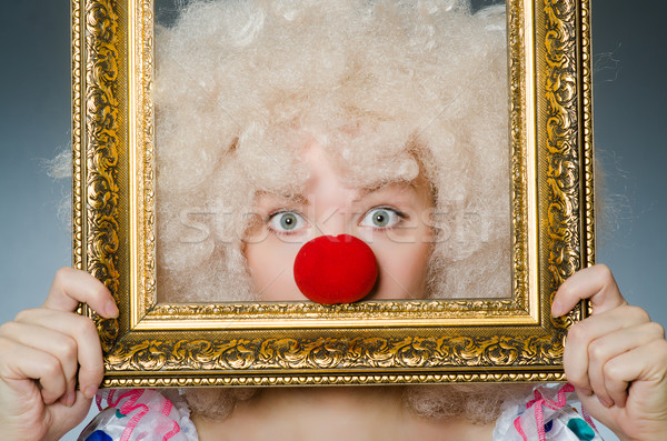 Funny clown with picture frame Stock photo © Elnur