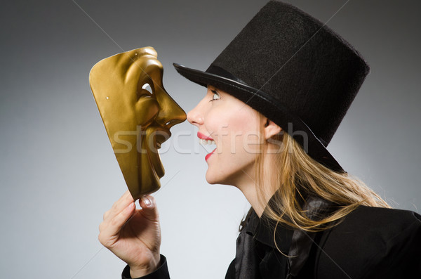 Woman with mask in funny concept Stock photo © Elnur