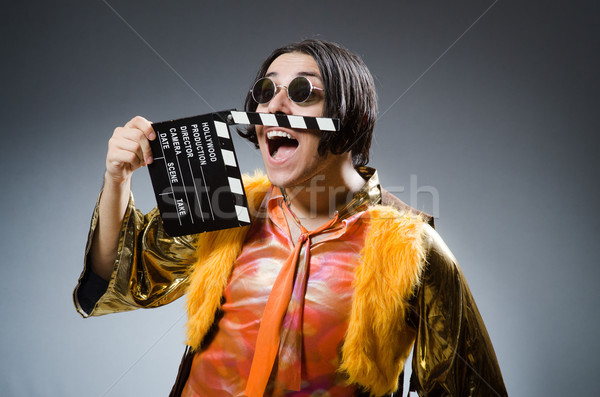 Young man with movie board Stock photo © Elnur