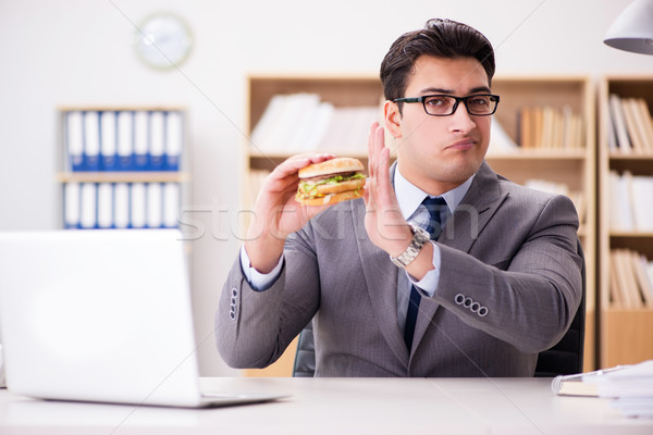 Faminto engraçado empresário alimentação sanduíche Foto stock © Elnur