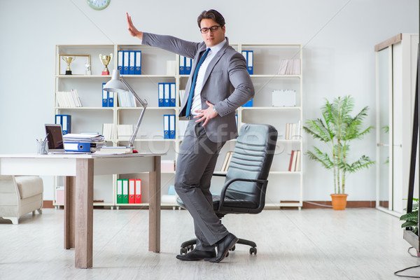 Businessman having fun taking a break in the office at work Stock photo © Elnur