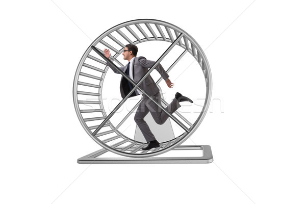 Business concept with businessman running on hamster wheel Stock photo © Elnur