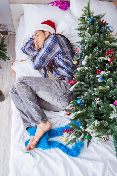 Man suffering hangover after christmas party Stock photo © Elnur