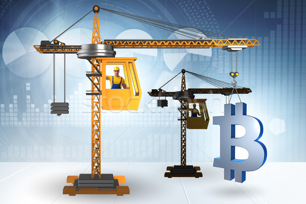 Construction crane lifting bitcoin in cryptocurrency concept Stock photo © Elnur