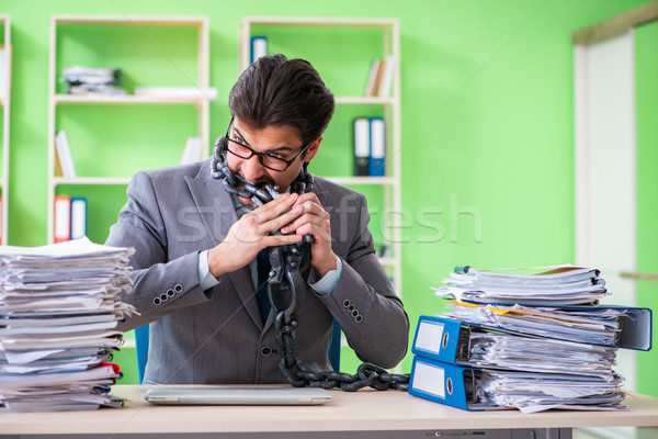 Employee chained to his desk due to workload Stock photo © Elnur