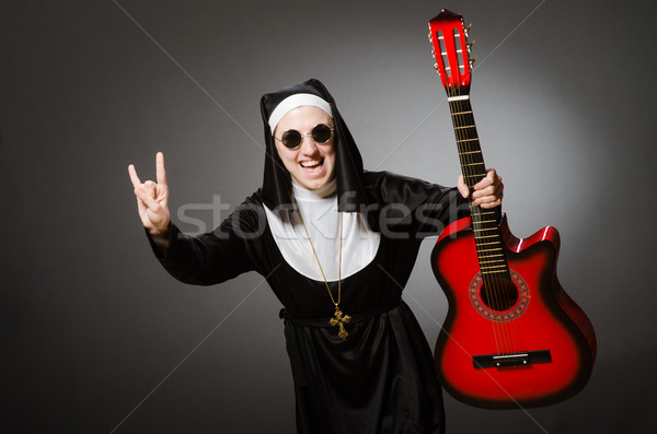 Drôle nonne rouge guitare jouer musique [[stock_photo]] © Elnur