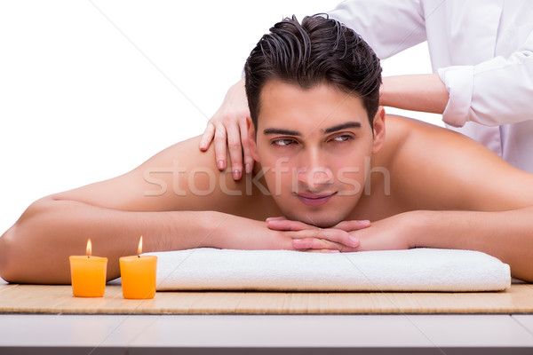 Handsome man during spa massaging session Stock photo © Elnur