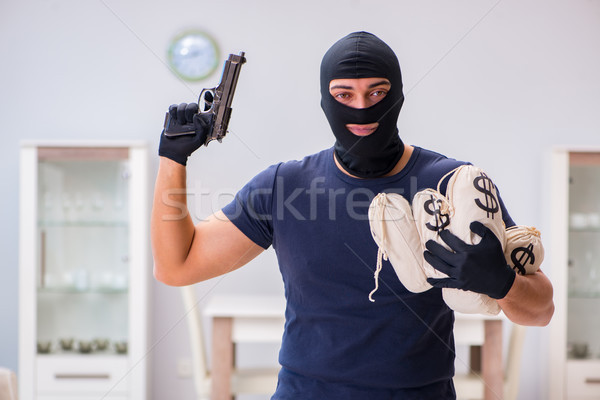 Robber wearing balaclava stealing valuable things Stock photo © Elnur