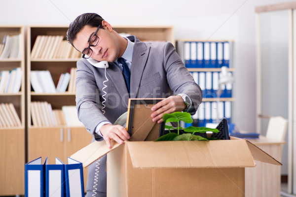 Young businessman moving offices after being made redundant Stock photo © Elnur