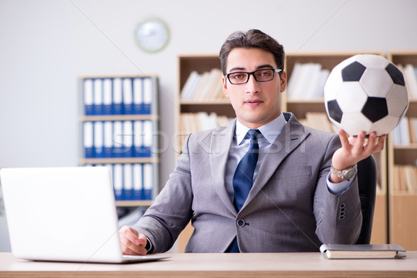Businessman with football ball in office Stock photo © Elnur