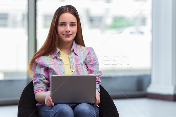Young girl surfing internet on laptop Stock photo © Elnur