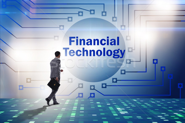 Businesswoman walking towards financial technology fintech Stock photo © Elnur