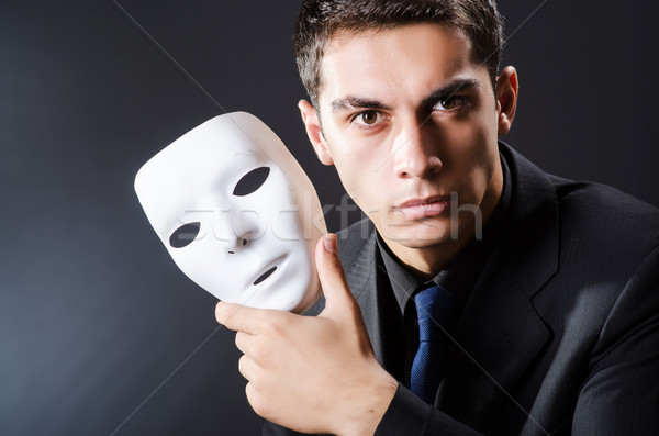 Man with mask in the dark Stock photo © Elnur