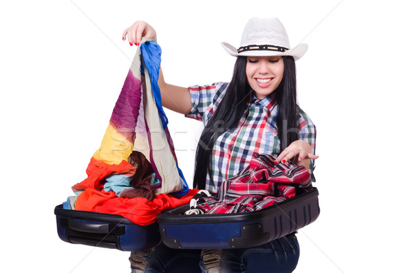 Woman trying to pack too much isolated on white Stock photo © Elnur