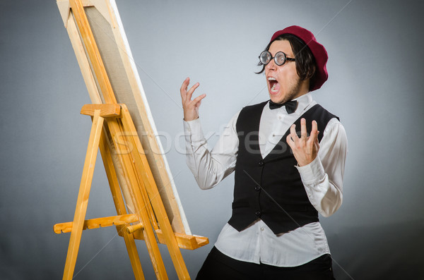 Funny artist in dark studio Stock photo © Elnur