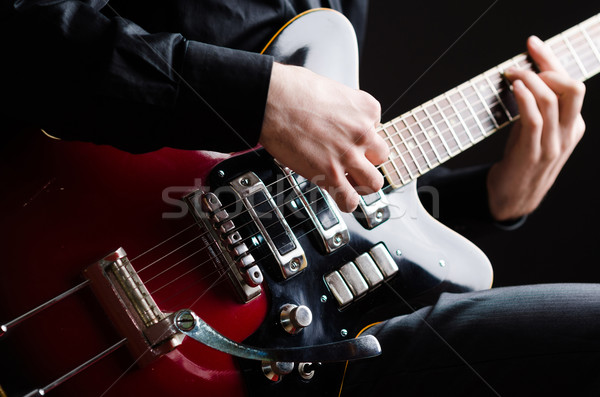 Stock photo: Man with guitar during concert