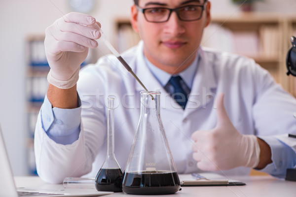 Young lab assistan working in the laboratory Stock photo © Elnur