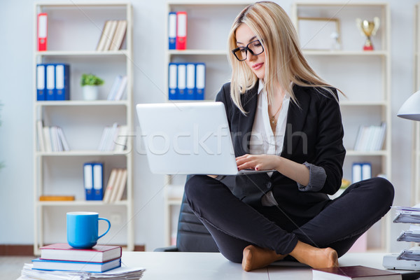 Businesswoman frustrated meditating in the office Stock photo © Elnur