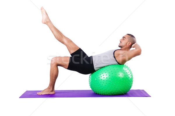 Man with swiss ball doing exercises on white Stock photo © Elnur