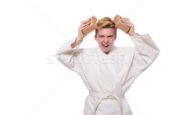 Amuzant karate om cărămizi izolat alb Imagine de stoc © Elnur