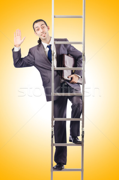 Businessman climbing the ladder isolated on white Stock photo © Elnur