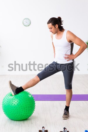 Young woman exercising with swiss ball Stock photo © Elnur