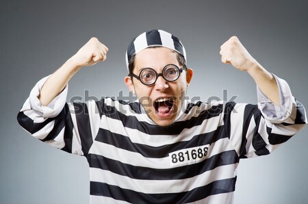 Young prisoner against gray Stock photo © Elnur