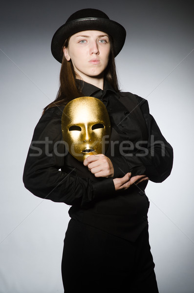 Woman with mask in funny concept Stock photo © Elnur